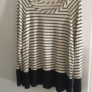Knit navy blue and cream striped top,peplum detail